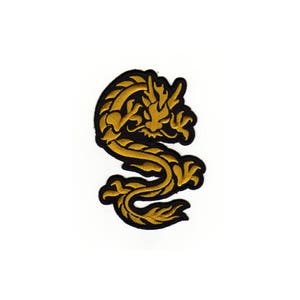 Könnte beinhalten: Ein aufbügelbarer Patch mit einem gestickten, stilisierten goldenen Drachen.