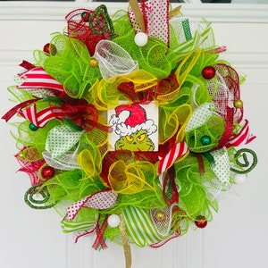 Size 14&quot; across- SMALL- The Green Christmas Monster face with Santa hat mesh wreath