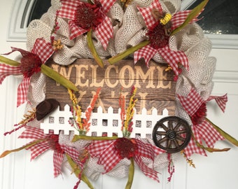 Welcome Y'all White Burlap Wreath with Red and White Gingham Ribbon a fence and county appeal