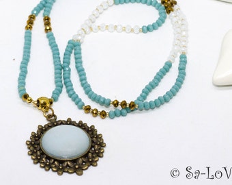 Crystal necklace turquoise white old gold with Polaris amulet, crystal necklace