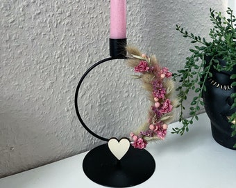 Candlestick with dried flowers and candle