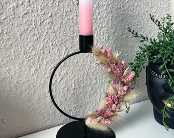 Candlestick with dried flowers and candle