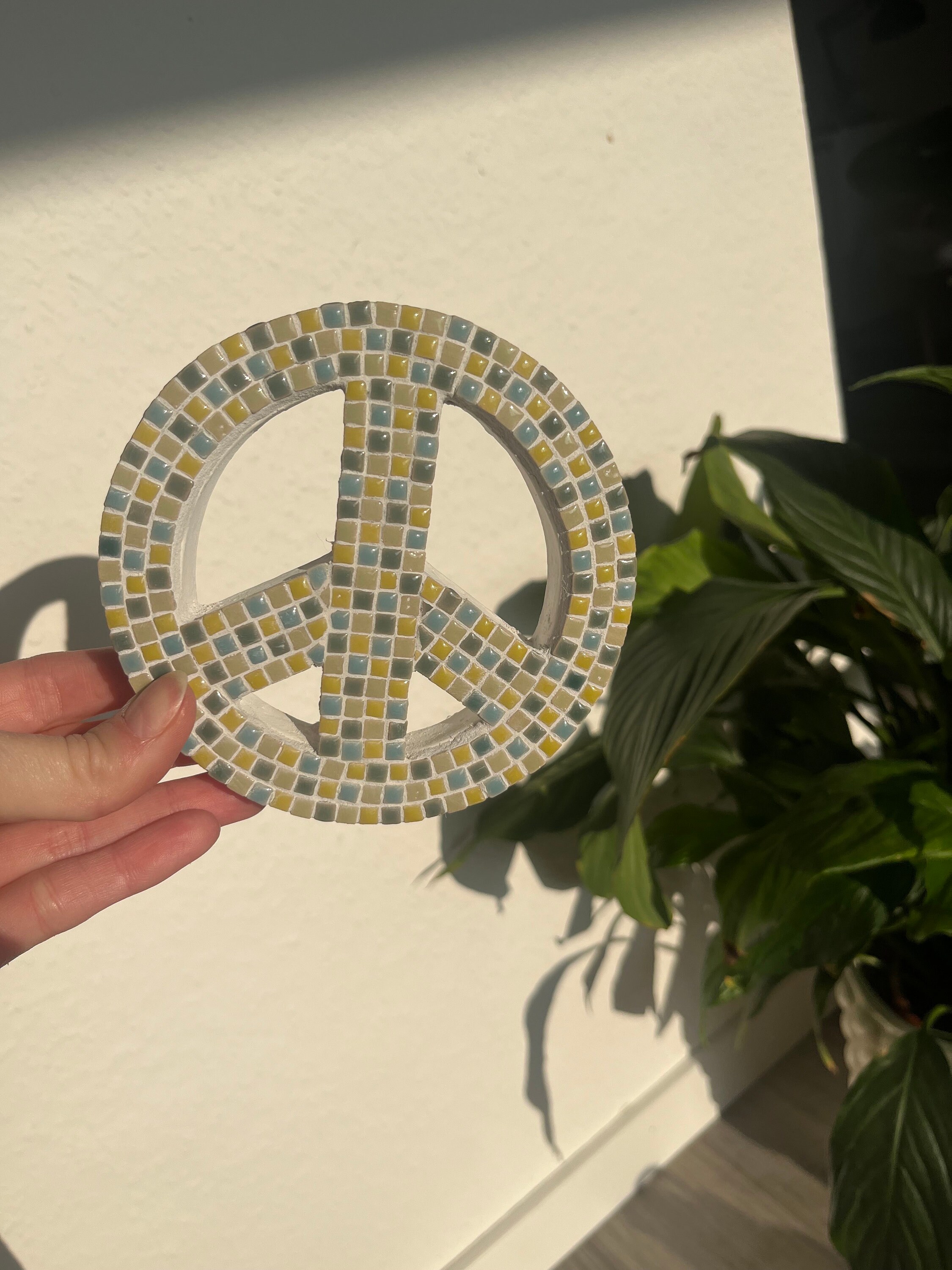 small colorful ceramic mosaic stone peace sign