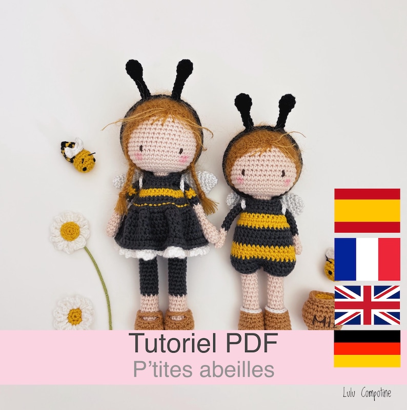 May include: Two handmade crochet dolls dressed as bees, with black and yellow striped outfits, black antennae, and wings. One doll wears a black dress, the other a yellow and black jumpsuit. The dolls are holding hands. The image includes a crochet bee and flowers.