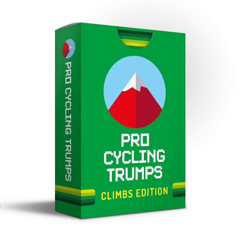 May include: Green box with a red mountain and white snow peak inside a blue circle. The text "PRO CYCLING TRUMPS CLIMBS EDITION" is printed on the box.