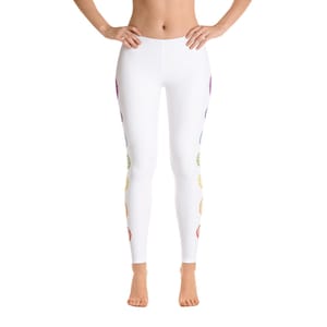 May include: White leggings with a colorful chakra design. The leggings feature a series of seven vibrant, rainbow-colored symbols running down the sides. The design is symmetrical, with the same pattern on both legs. The leggings are made of a soft, stretchy material.
