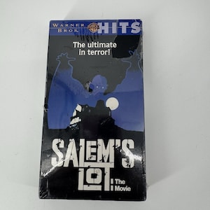 May include: A VHS tape for the movie "Salem's Lot" from Warner Bros. The cover features a dark blue background with a silhouette of a house and a full moon. The text reads "The ultimate in terror!"