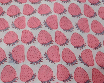 May include: White fabric with a repeating pattern of pink strawberries. The strawberries have a dotted design and are outlined in gray.