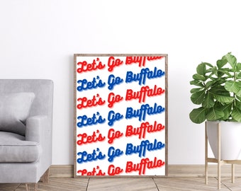 May include: A framed print with the text "Let's Go Buffalo" repeated in red and blue lettering on a white background.