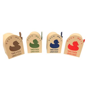 May include: Four small, beige cardboard mailboxes with a duck theme. Each box features a different colored duck graphic (brown, green, blue, and red) and the text "DUCK MAIL" and "TAKE A DUCK LEAVE A DUCK". The mailboxes have small flags.