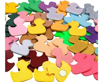 May include: A collection of colorful foam duck shapes in various shades of yellow, pink, green, purple, brown, and blue. The ducks are scattered, with some appearing to have a magnetic backing. These craft supplies are ideal for DIY projects.