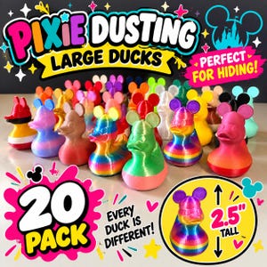 May include: A 20-pack of 2.5-inch tall rubber ducks featuring mouse-ear silhouettes. The ducks are multicolored, including solid, gradient, and striped patterns in shades of pink, blue, green, yellow, orange, and black. Text reads Pixie Dusting Large Ducks, Perfect for Hiding, 20 Pack, Every Duck is Different, and 2.5 inch tall.
