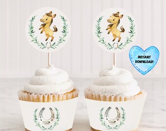 May include: Two cupcakes with white frosting, each decorated with a horse-themed topper and wrapper. The toppers feature a watercolor illustration of a brown horse inside a green wreath. The wrappers display a horseshoe and wreath design. A blue heart with the text "INSTANT DOWNLOAD!" is also visible.