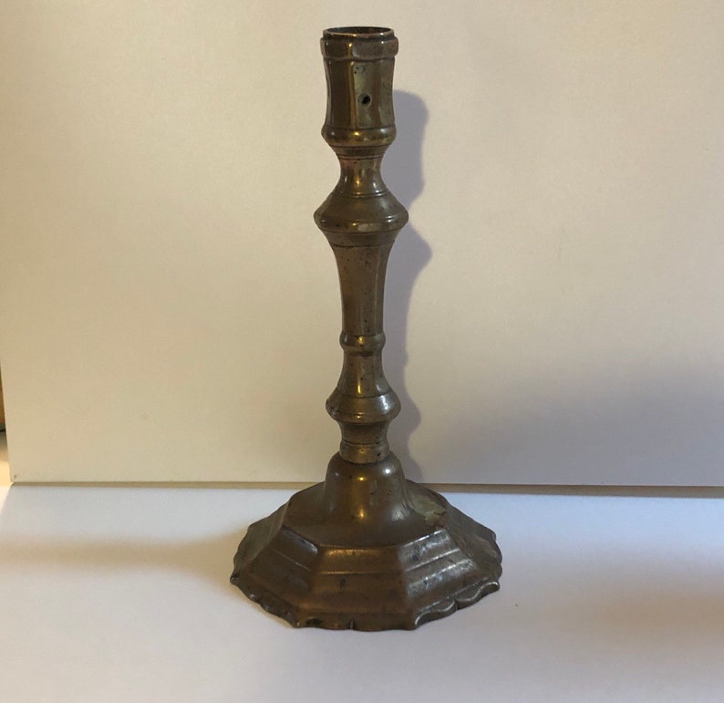 Former High Period bronze candlestick