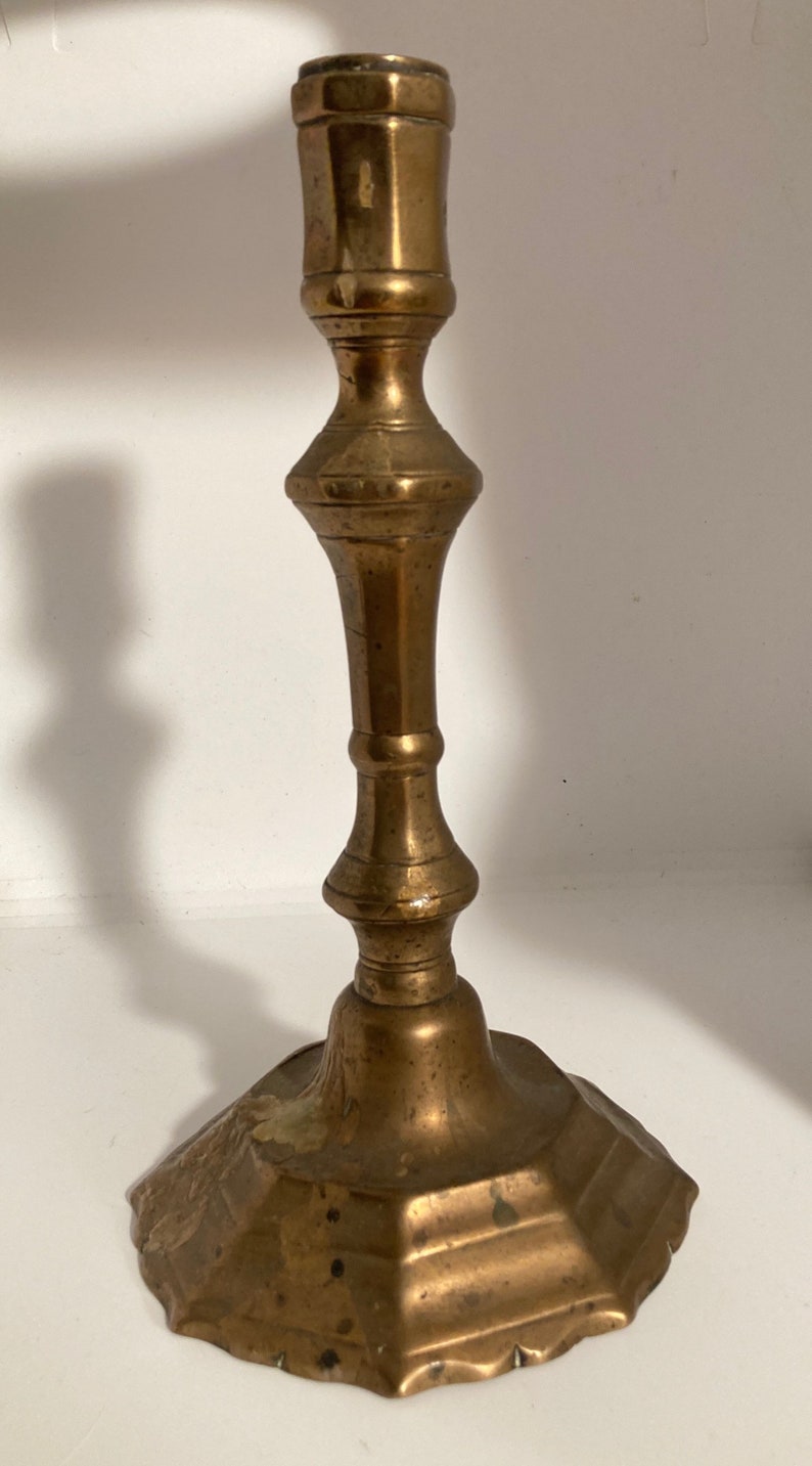 Former High Period bronze candlestick