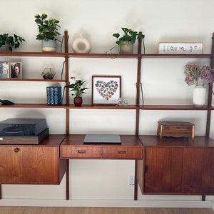 Mid Century 1960’s Modular Danish Teak and Brass Royal System Poul Cadovius Style Bookshelf Three Bay Wall Unit Desk