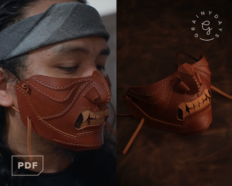 Pu&ograve; includere: Una maschera in pelle marrone con un design dettagliato che ricorda un viso con denti aguzzi. La maschera &egrave; indossata da una persona con una bandana grigia sulla testa. La maschera ha una corda attaccata.
