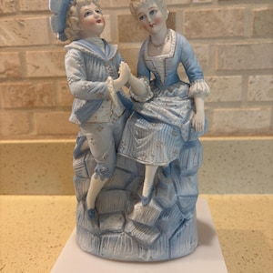 bisque porcelain man and woman vintage figurine