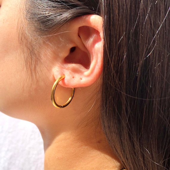 thick gold hoop earrings — Maekavera