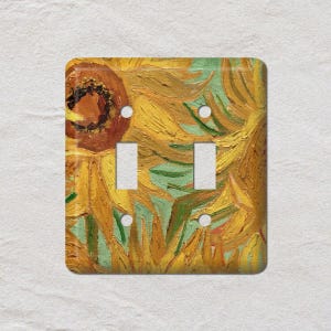 May include: A double light switch cover with a painting of sunflowers in yellow, orange, and green. The artwork is in the style of Van Gogh, adding an artistic touch to any room. The cover has two switch openings.