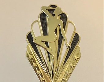 May include: Gold trophy with a purple base and a dancer silhouette on top. The base has a gold band around it and the words "YOUR WORDS HERE!" are on the base.