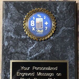 May include: A black marble plaque with a gold-colored circular award featuring a calculator and the text "5% 8 × Math 2 + 7". The plaque has a black brass plate with the text "Your Personalized Engraved Message on Black Brass Plate Included!"