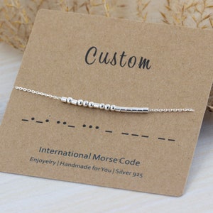 May include: A silver bracelet with a custom message in International Morse Code. The bracelet is made of silver 925 and is handmade. The message is "Custom".