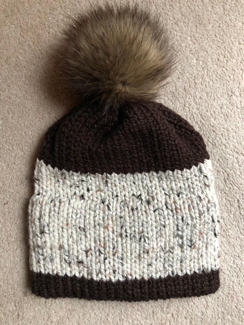 flat cap with pom pom