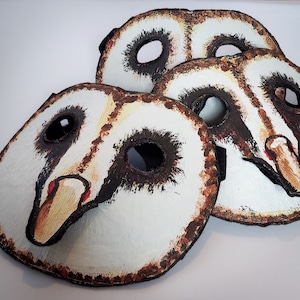 Hand made, hand painted owl masks, with black rimmed eye holes and delicate beaks. These masks are great for Halloween, costume and masquerade parties, photo and video props, and fun times.