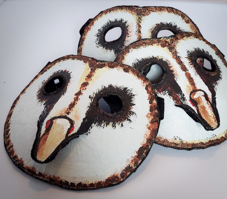 Hand made, hand painted owl masks, with black rimmed eye holes and delicate beaks. These masks are great for Halloween, costume and masquerade parties, photo and video props, and fun times.
