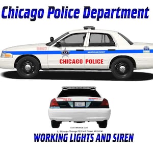 May include: A white Chicago Police Department Ford Crown Victoria model car with blue and red accents. The text "Chicago Police" is visible on the side of the car. The image also shows the text "Working Lights and Siren".