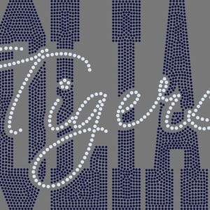 May include: A graphic design featuring the word GOLIATH in large, dark blue dotted letters against a gray background, overlaid with the word Tigers written in a white, cursive, rhinestone-style font made of small circular dots.