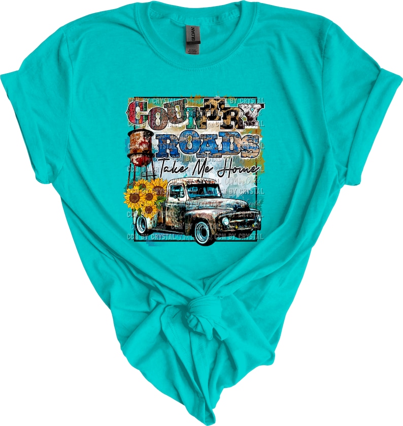 May include: A turquoise t-shirt with a graphic design of a vintage truck, water tower, sunflowers, and the text "Country Roads Take Me Home".