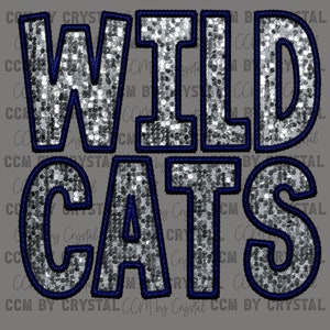 May include: The word "WILD CATS" in a silver sequin design with a navy blue outline, set against a gray background. The text is in a bold, blocky font, suitable for apparel or team merchandise.
