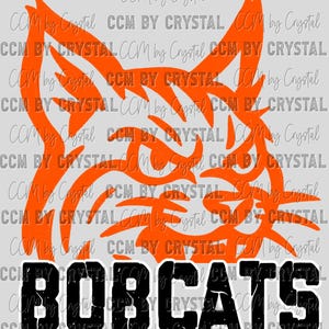 May include: Orange silhouette of a wildcat with the word "BOBCATS" in black and white below. The design is repeated with the text "CCM by Crystal" in the background. This graphic is suitable for apparel and fan merchandise.