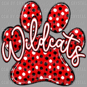 May include: A graphic design featuring a red paw print with black and white polka dots. The word "Wildcats" is written in white script with a red outline across the paw print. The background is a solid gray color.