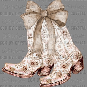 May include: A pair of brown cowboy boots with a floral pattern and a large brown bow on top. The boots are on a gray background.