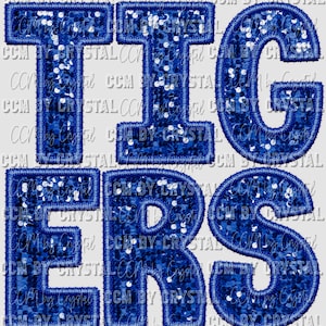 May include: Blue sparkly letters spelling out "TIGERS" with a white background.