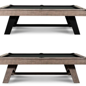 May include: A wooden pool table with a black felt top and black metal legs. The table has a rustic, distressed look.