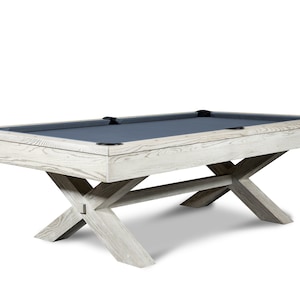 May include: A white wooden pool table with a gray felt top and a unique X-shaped base.