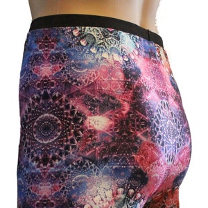 May include: Purple, blue, and pink leggings with a colorful mandala pattern.