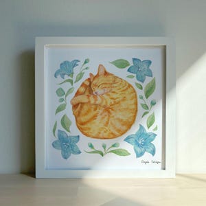 A tabby orange cat curled up with a happy face, surrounded by star-shaped blue flowers and green leaves.