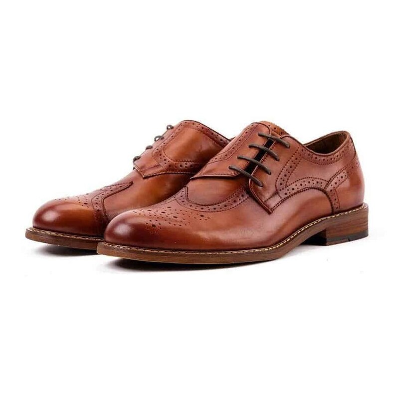 May include: A pair of brown leather brogue shoes with lace-up closures. The shoes have a wingtip design and a perforated pattern.