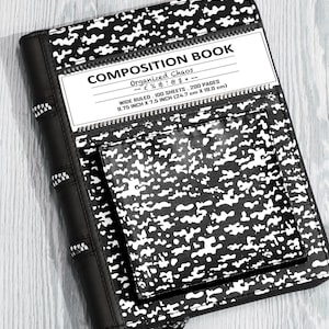 May include: A black and white composition book cover featuring a camouflage-like pattern, a front pocket, and a white label with the text COMPOSITION BOOK, Organized Chaos, and 9.75 inch x 7.5 inch dimensions, secured with a black zipper closure.