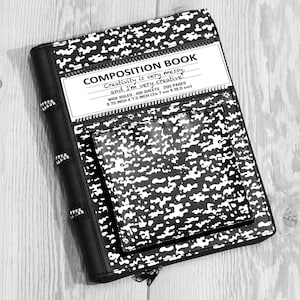 May include: A black and white composition book with a speckled pattern, featuring a front pocket and a label that reads: COMPOSITION BOOK, Creativity is very messy, and I'm very creative, WIDE RULED, 100 SHEETS, 200 PAGES, 9.75 INCH X 7.5 INCH.