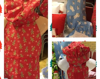 Zestaw składający się z czapki i fartucha kucharskiego.