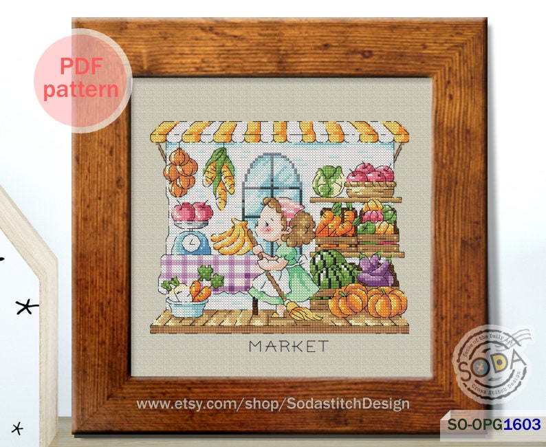 May include: A cross-stitch pattern of a girl in a green dress standing in front of a market stall with a variety of fruits and vegetables. The stall has a sign that says "MARKET".