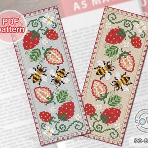 May include: Two cross-stitch bookmarks with strawberry and bee designs. The bookmarks feature red strawberries, green leaves, white flowers, and yellow and black bees. The text "Cross Stitch BOOKMARK" and "PDF pattern" are visible.