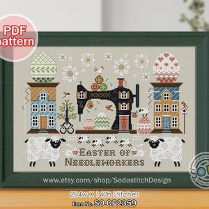May include: Cross-stitch pattern framed in a green wooden frame. The design features a black sewing machine, houses, sheep, and Easter eggs. Text includes "Easter of Needleworkers" and "PDF pattern". The pattern measures 204w x 140h stitches.