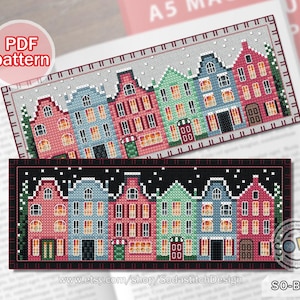 Pode incluir: Um padrão de marcador de ponto cruz com uma fileira de casas coloridas com neve nos telhados e um céu noturno estrelado. O padrão está disponível para download em PDF. O texto "SO-BM69" e "www.etsy.com/shop/SodastitchDesign" também estão incluídos na imagem.